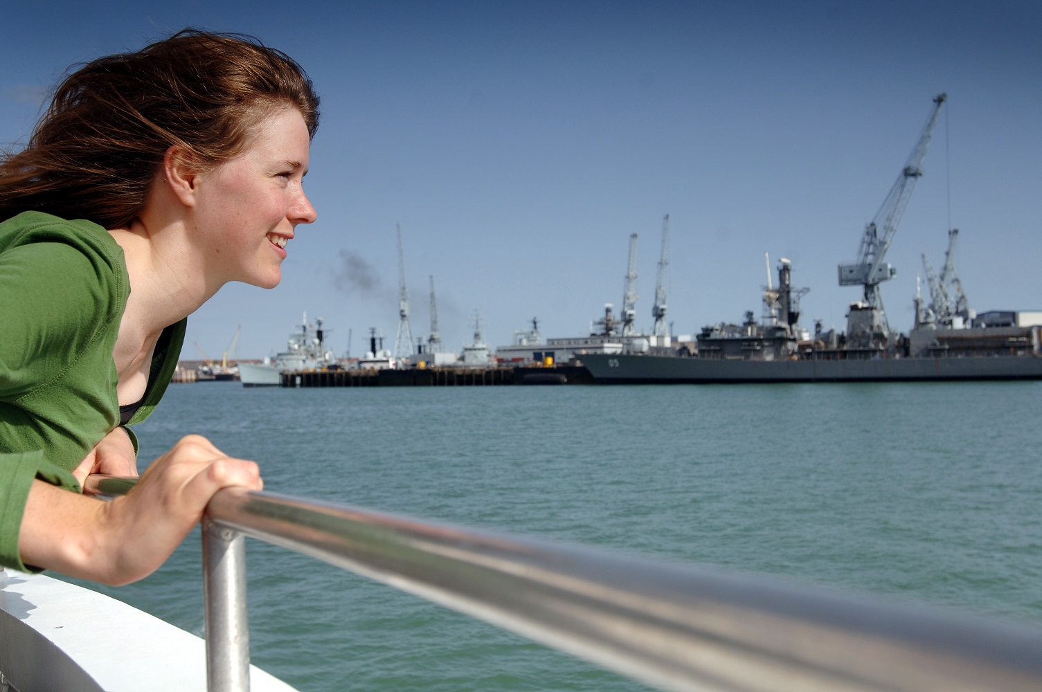 A visitor to Portsmouth Historic Dockyard enjoying a harbour tour